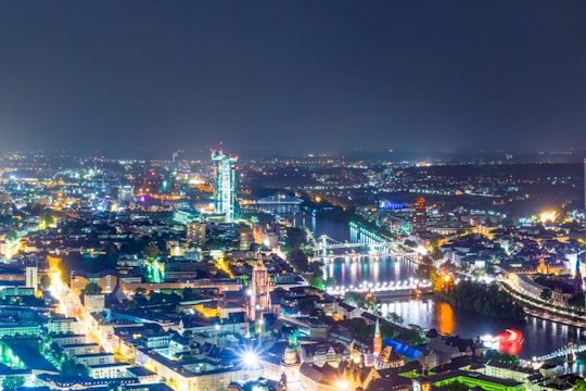 city with lights during night time in Frankfurt Germany