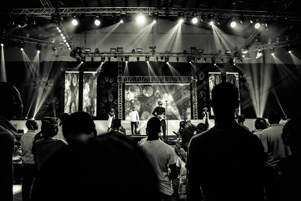 a group of people standing on top of a stage