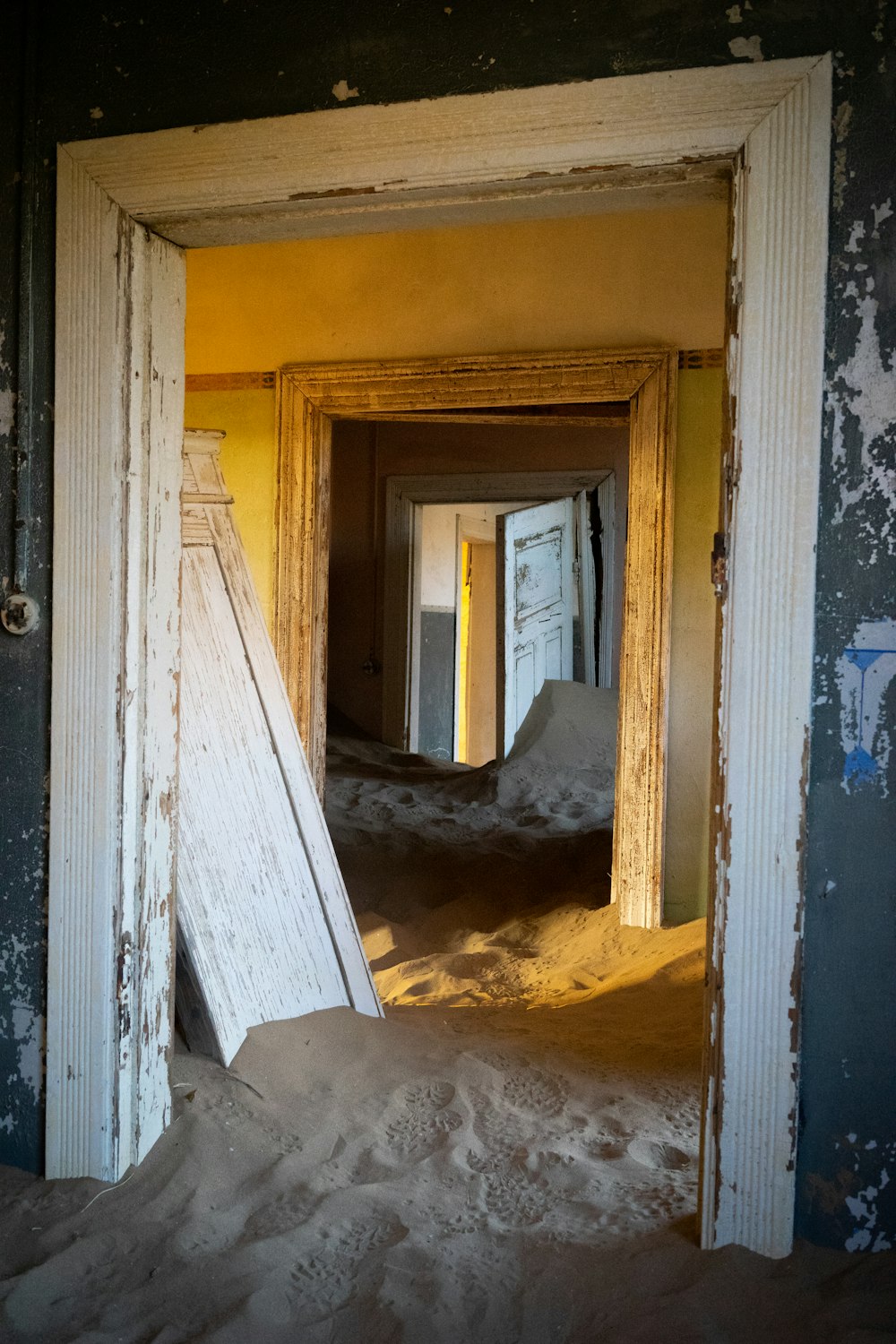 white wooden door with white snow