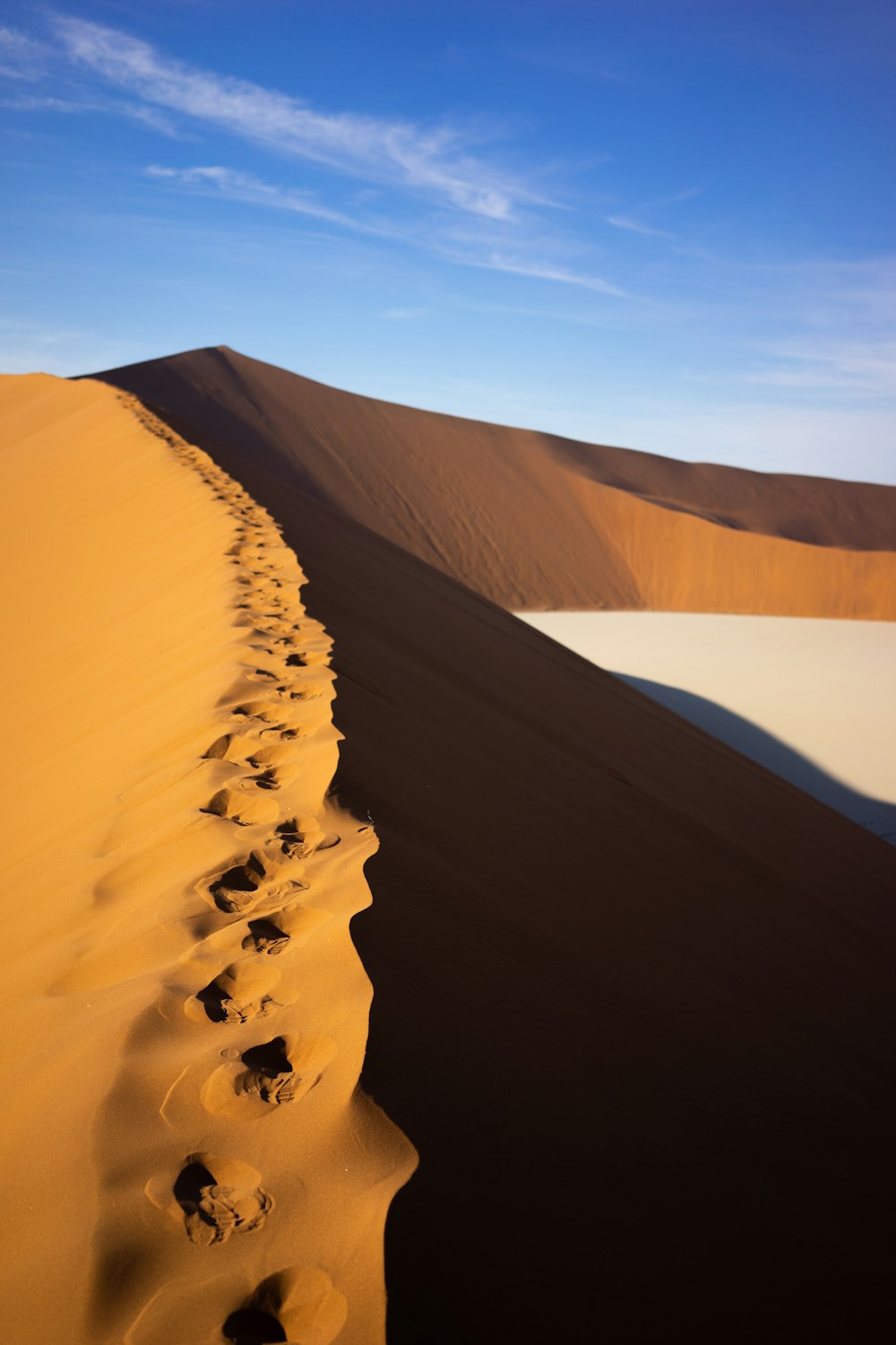 brown sand under blue sky during daytime