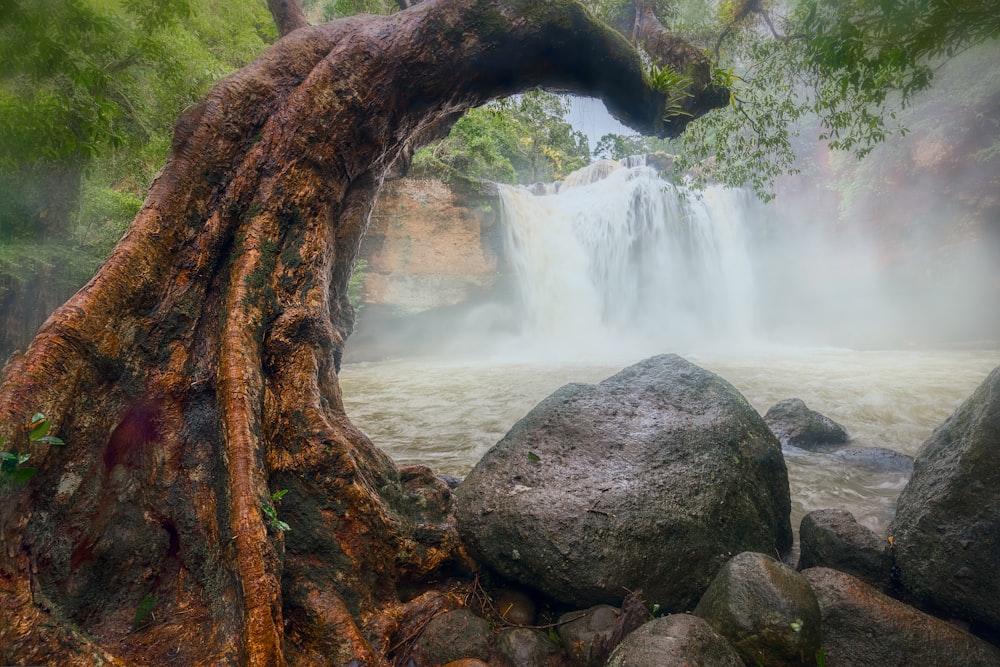 brown rock formation near waterfalls during daytime