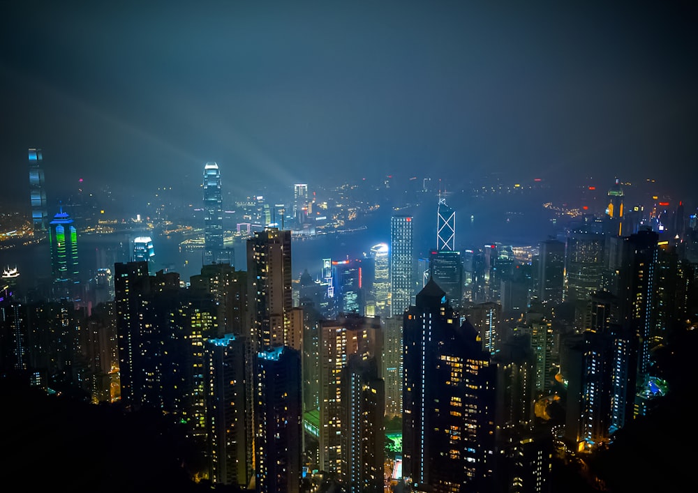 city with high rise buildings during night time