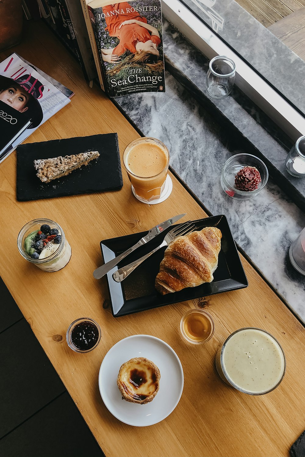 sliced bread on white ceramic plate beside white ceramic mug with coffee