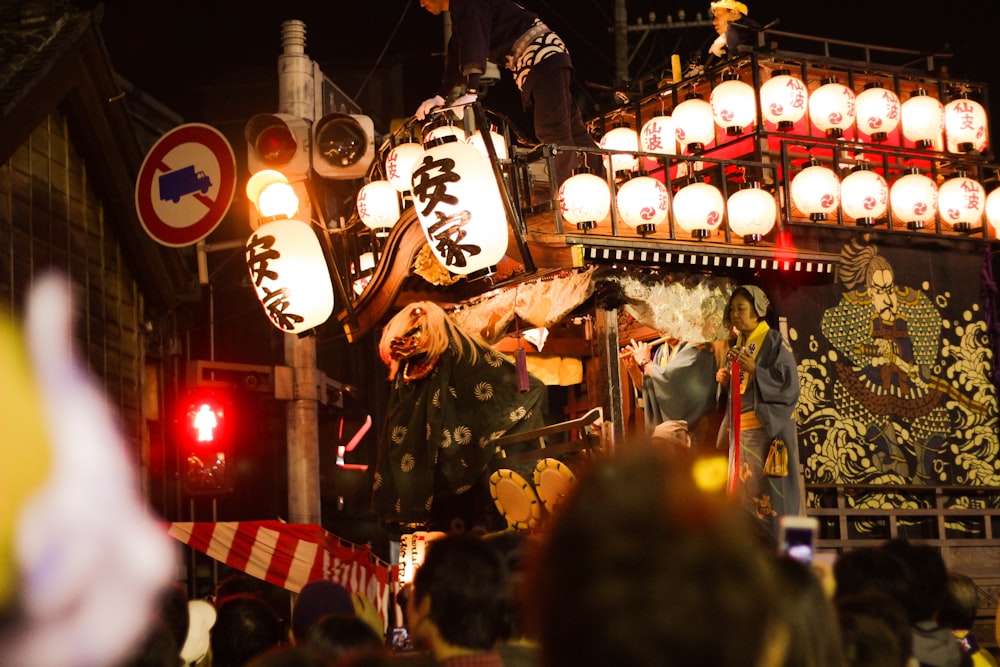 people standing on street during nighttime