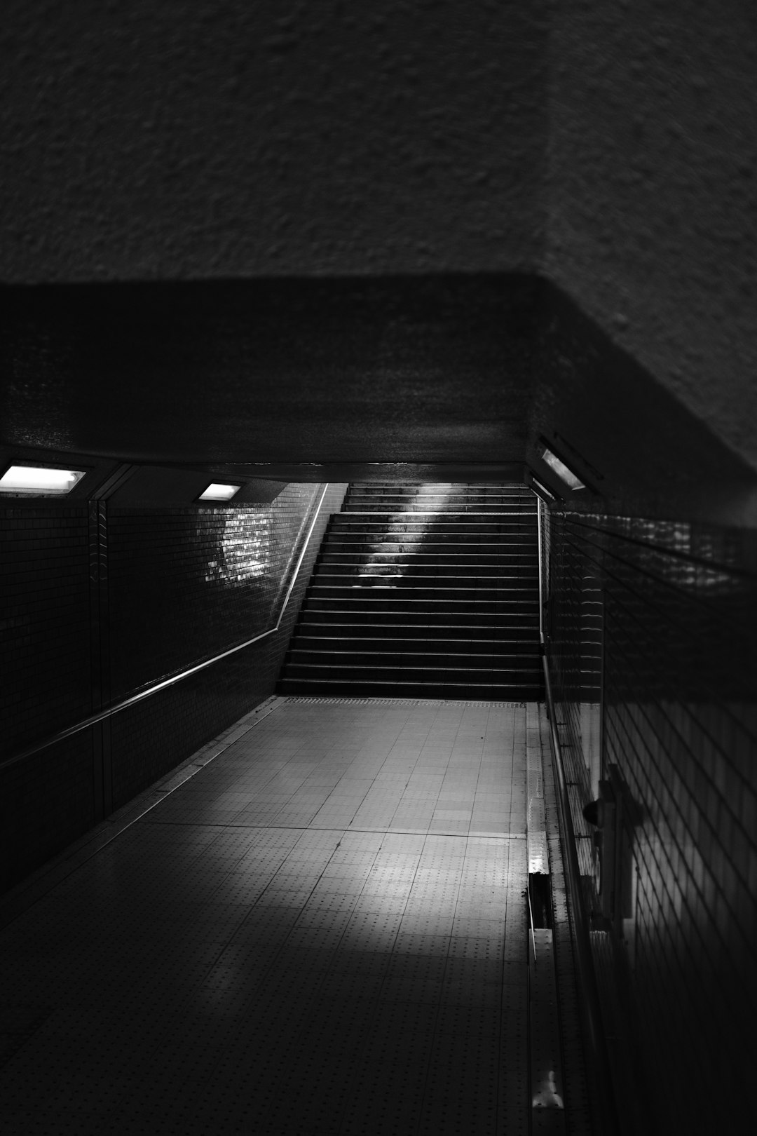 grayscale photo of empty hallway