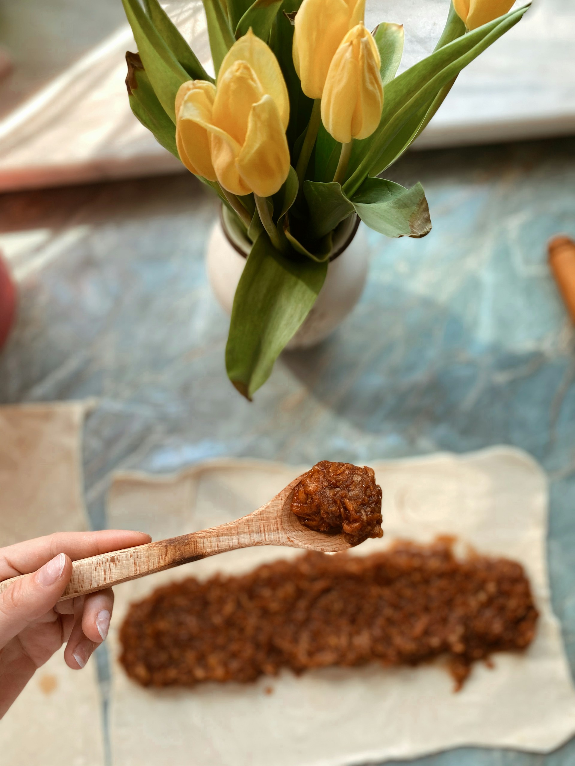 woman wearing yellow long-sleeved dress under white clouds and blue sky during daytime