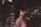 woman in pink scoop neck shirt wearing black sunglasses