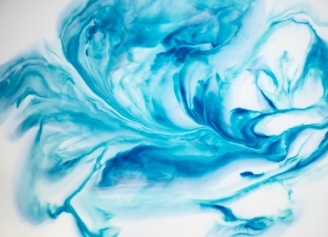 Abstract waves of indigo and pearl white blending smoothly to evoke astral lightness.