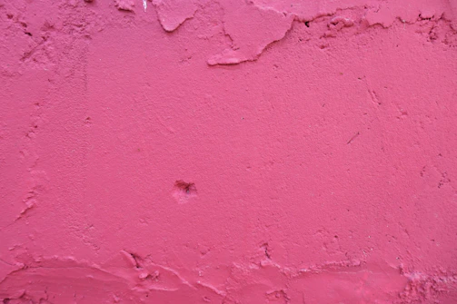 pink concrete wall during daytime