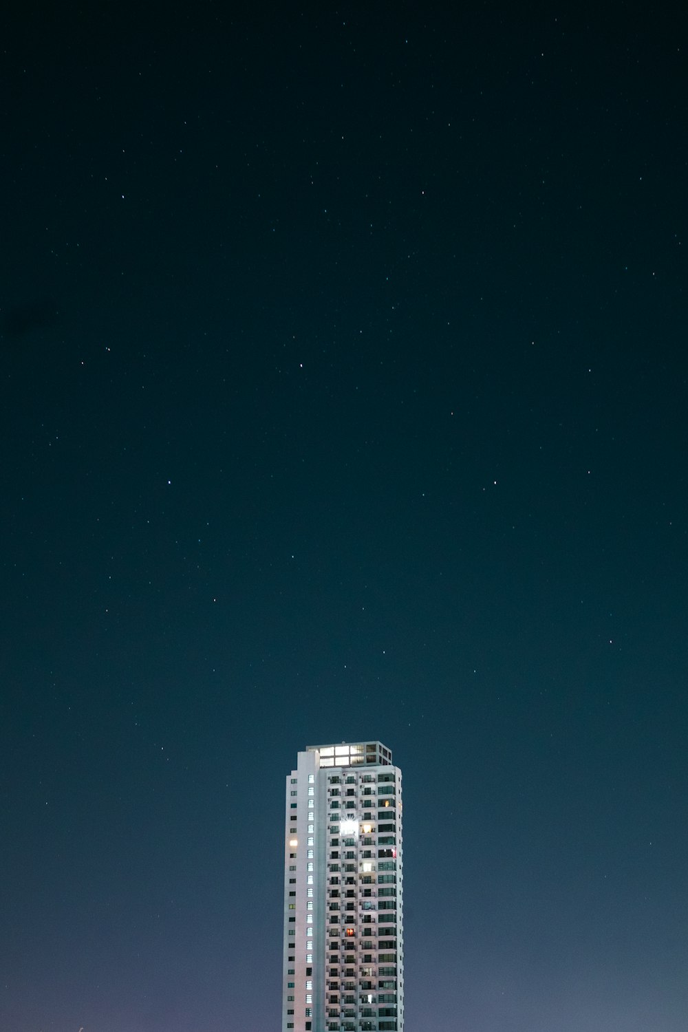 white high rise building during night time