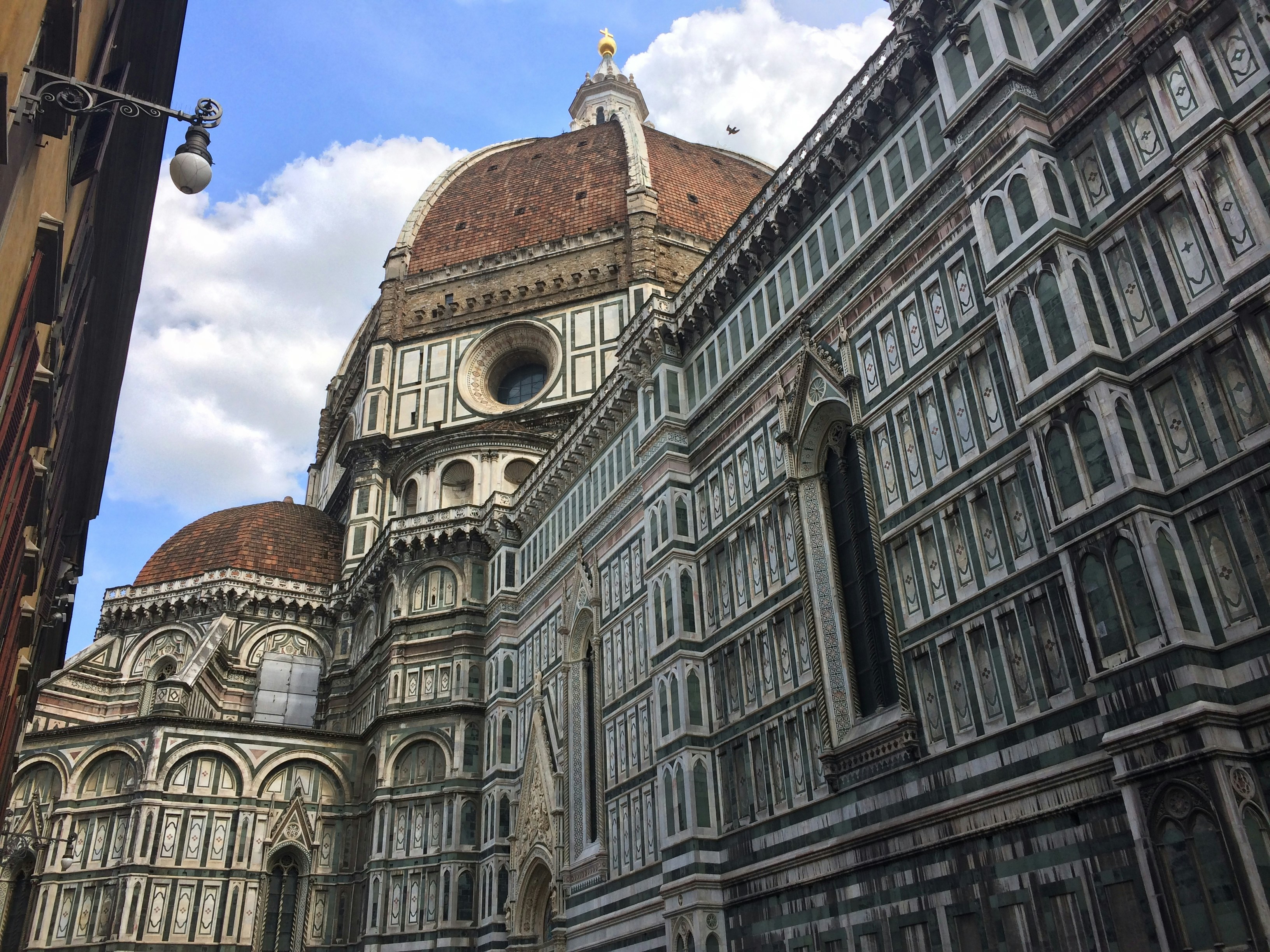 Brown and gray concrete building under blue sky during daytime