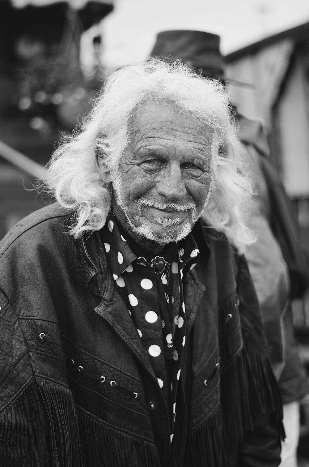 grayscale photo of woman in black coat