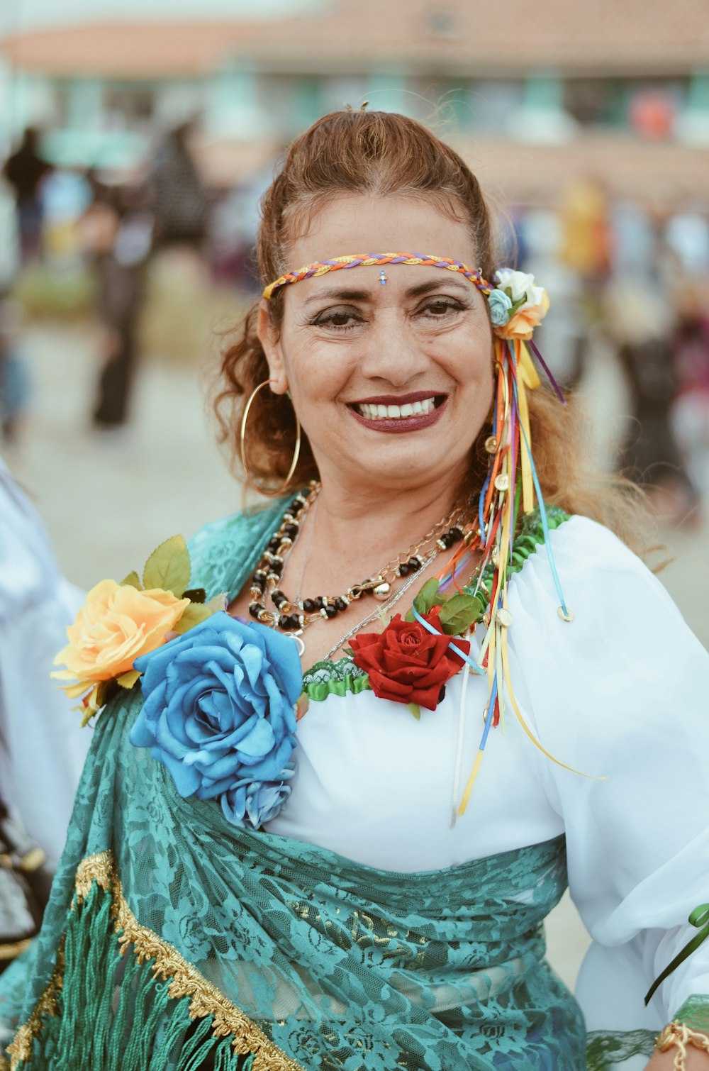 woman in green and white dress smiling