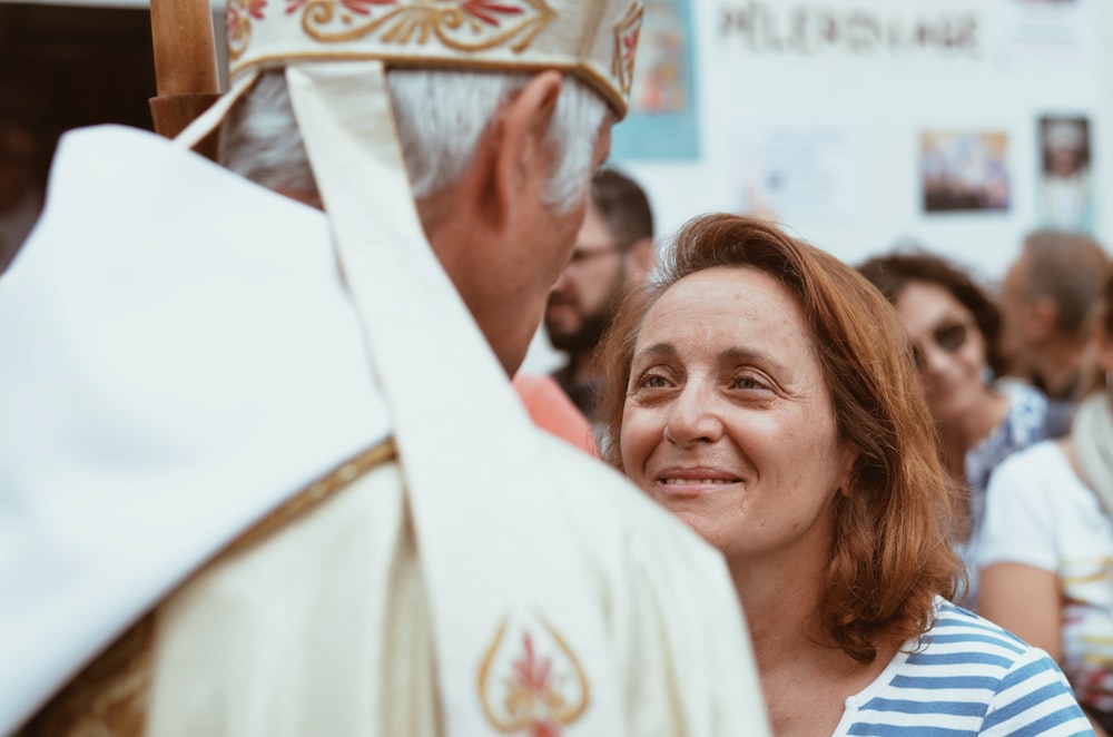 woman in white shirt smiling