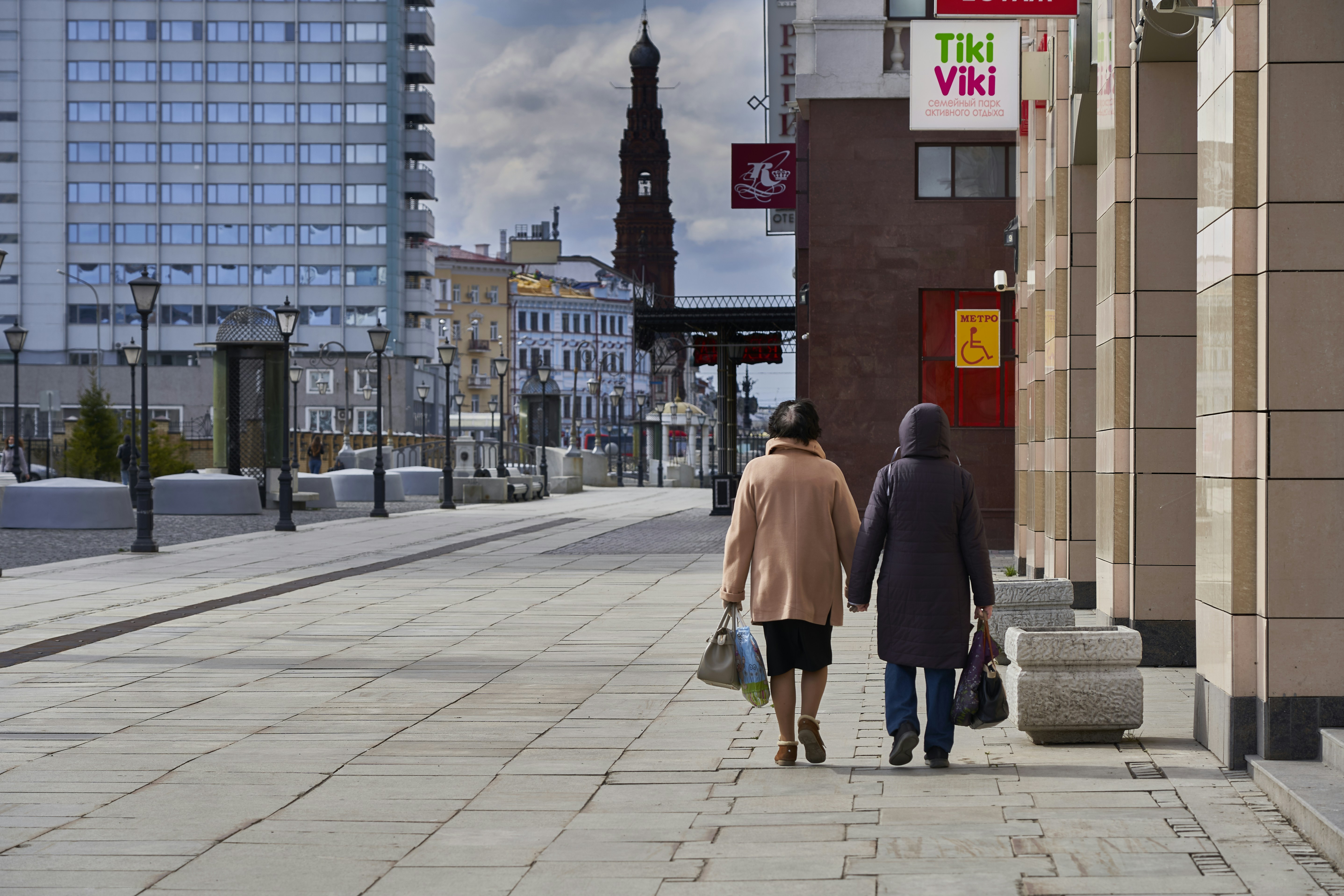 Woman in brown coat walking on sidewalk during daytime photo – Free ...