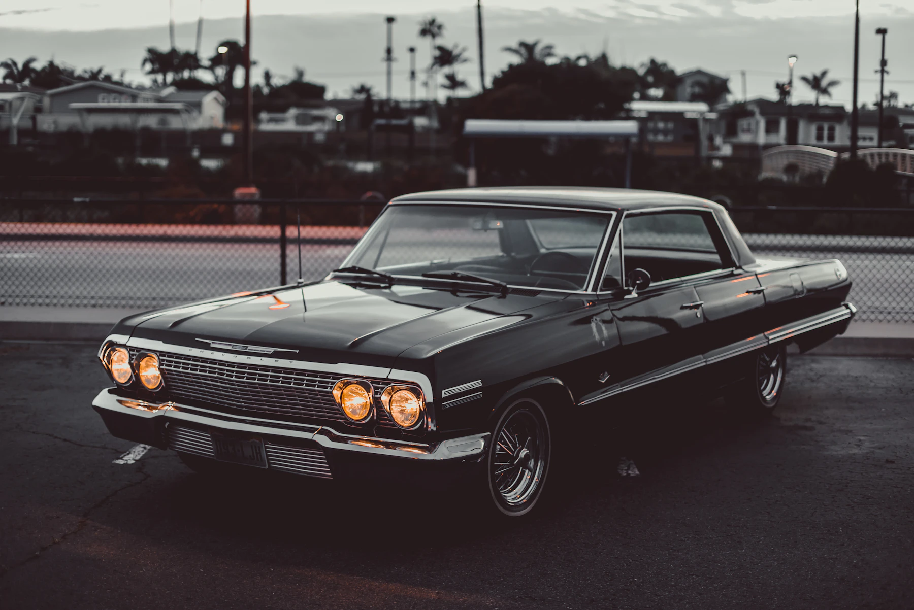 A classic Chevrolet Impala at dusk