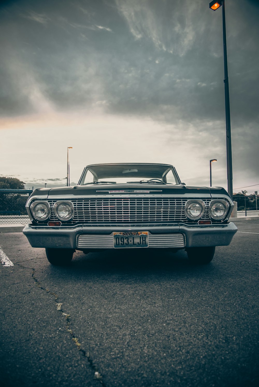 black car on gray asphalt road during daytime