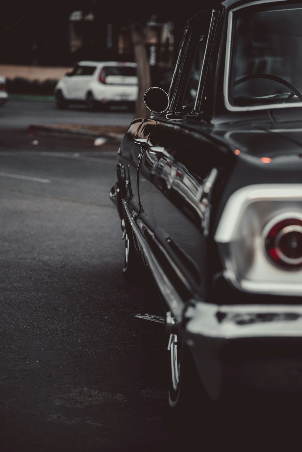 black and white vintage car on road during daytime
