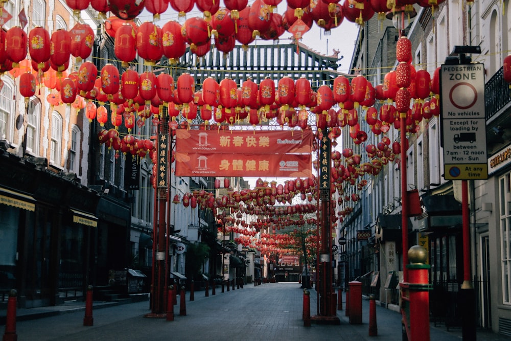 red chinese lanterns on street during daytime