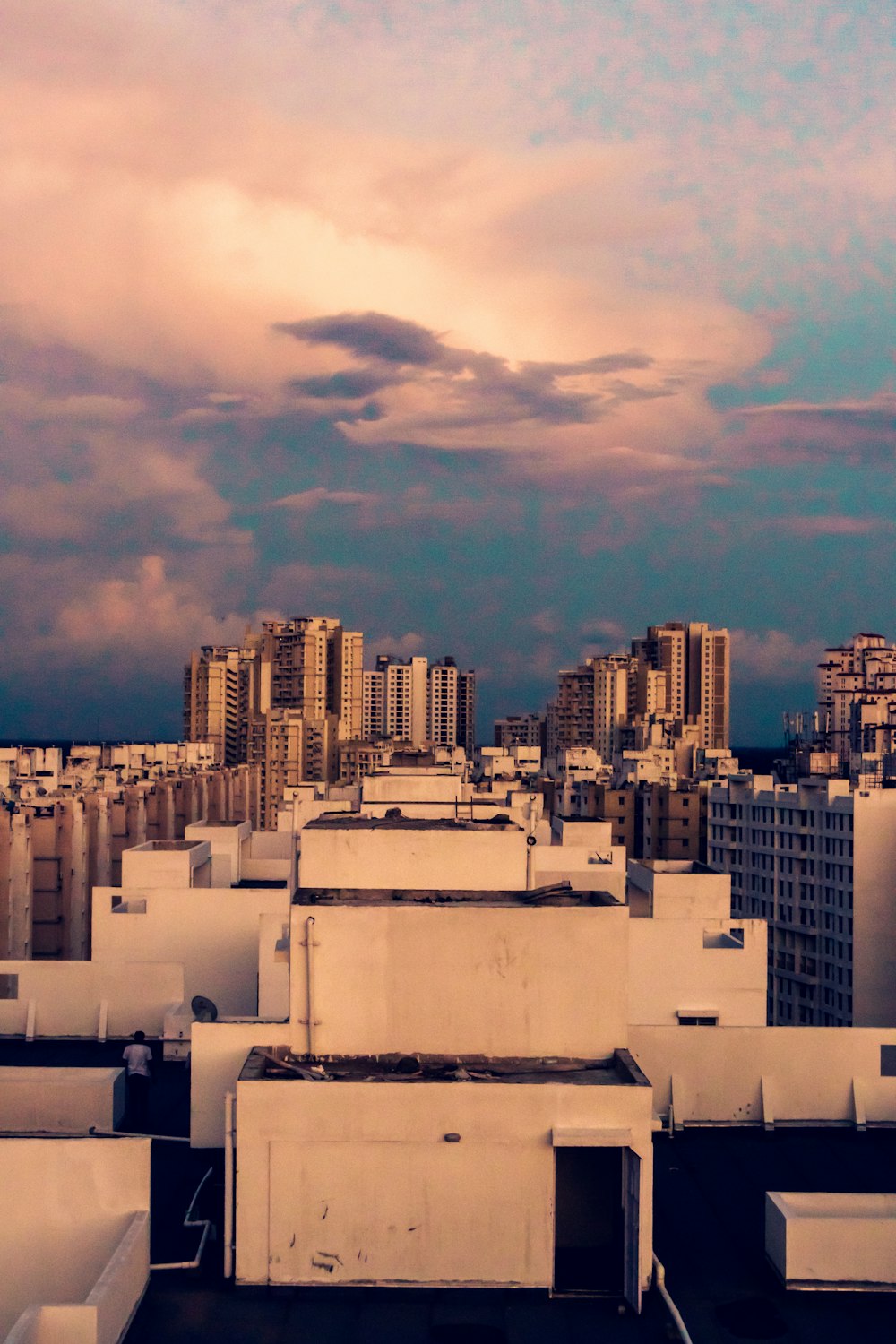 white concrete building under cloudy sky during daytime