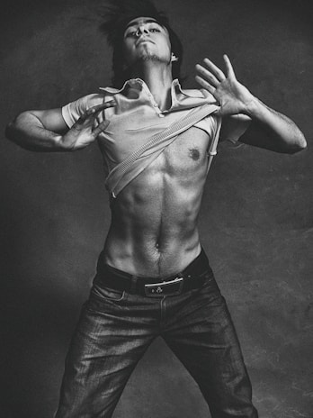 A dynamic shot of a man mid-motion, muscles rippling, capturing the essence of alpha energy in action.