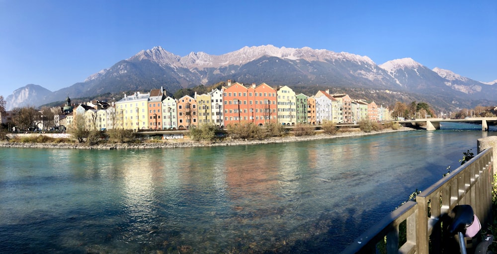 white and brown concrete buildings near body of water during daytime