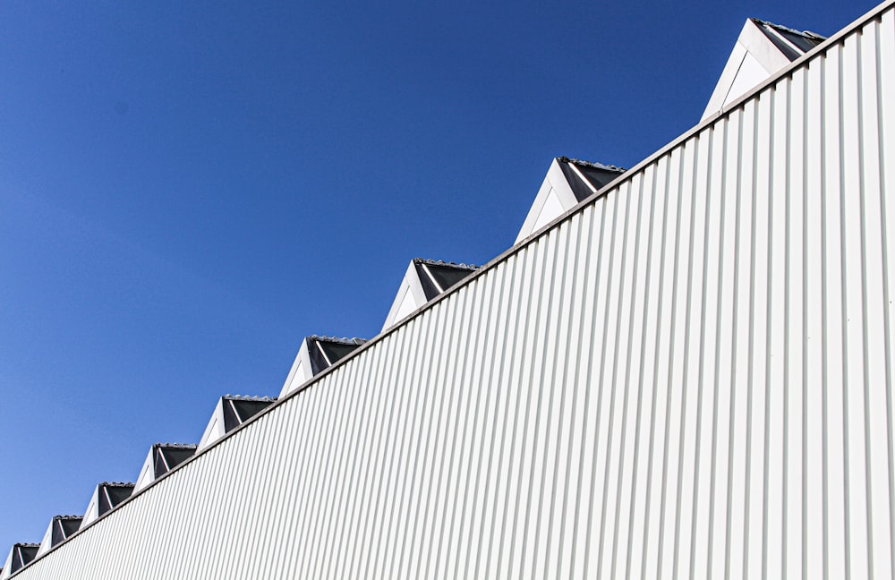 white and black concrete building under blue sky during daytime