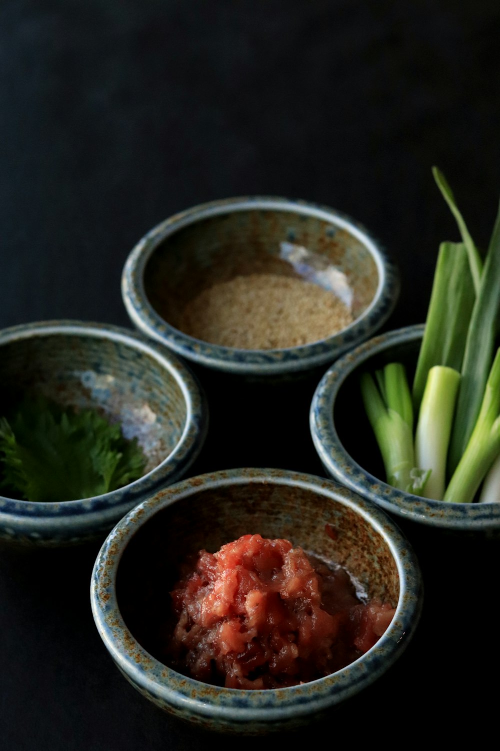 green vegetable on stainless steel bowls