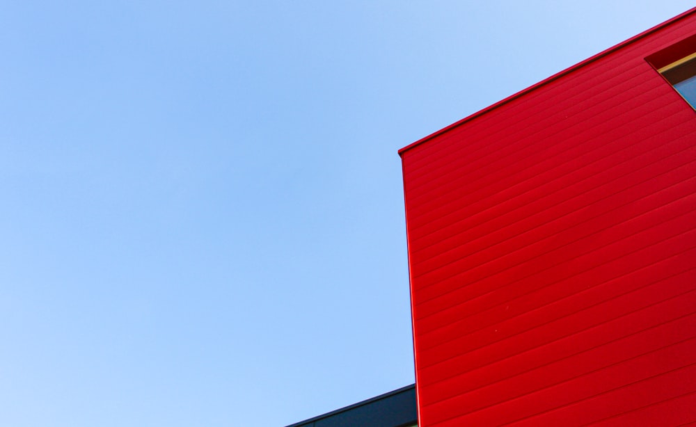 red and white concrete building under blue sky during daytime