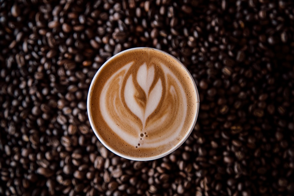 brown and white heart shaped coffee art