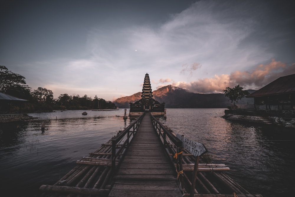 brown wooden dock on body of water during daytime