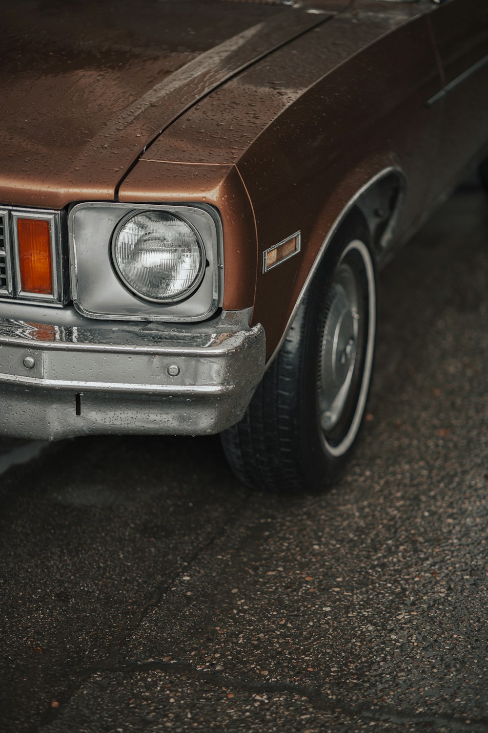 brown car on gray asphalt road