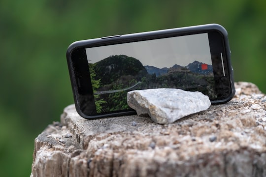 black android smartphone on gray rock in Highline179 Austria