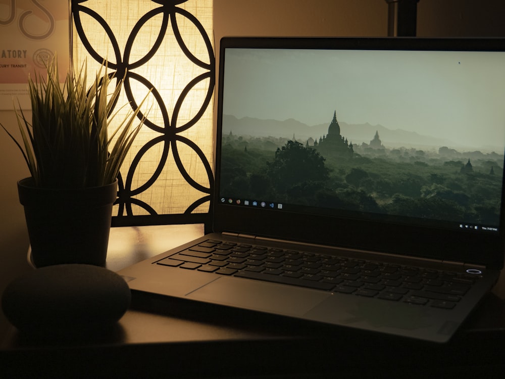 macbook pro on brown wooden table