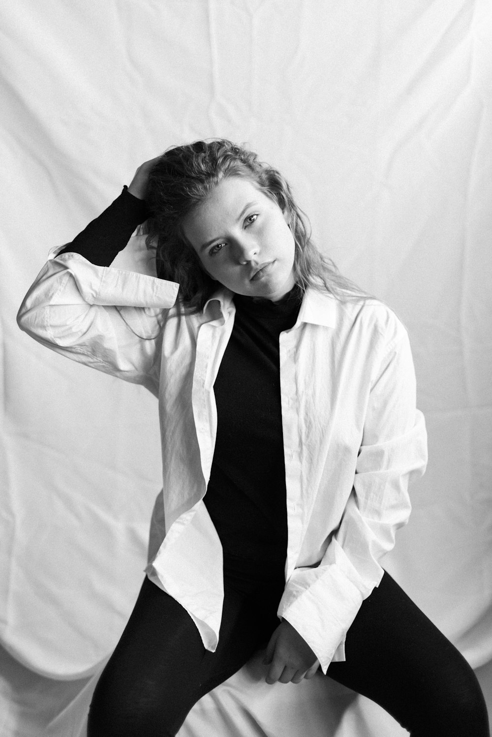 grayscale photo of girl in white button up shirt