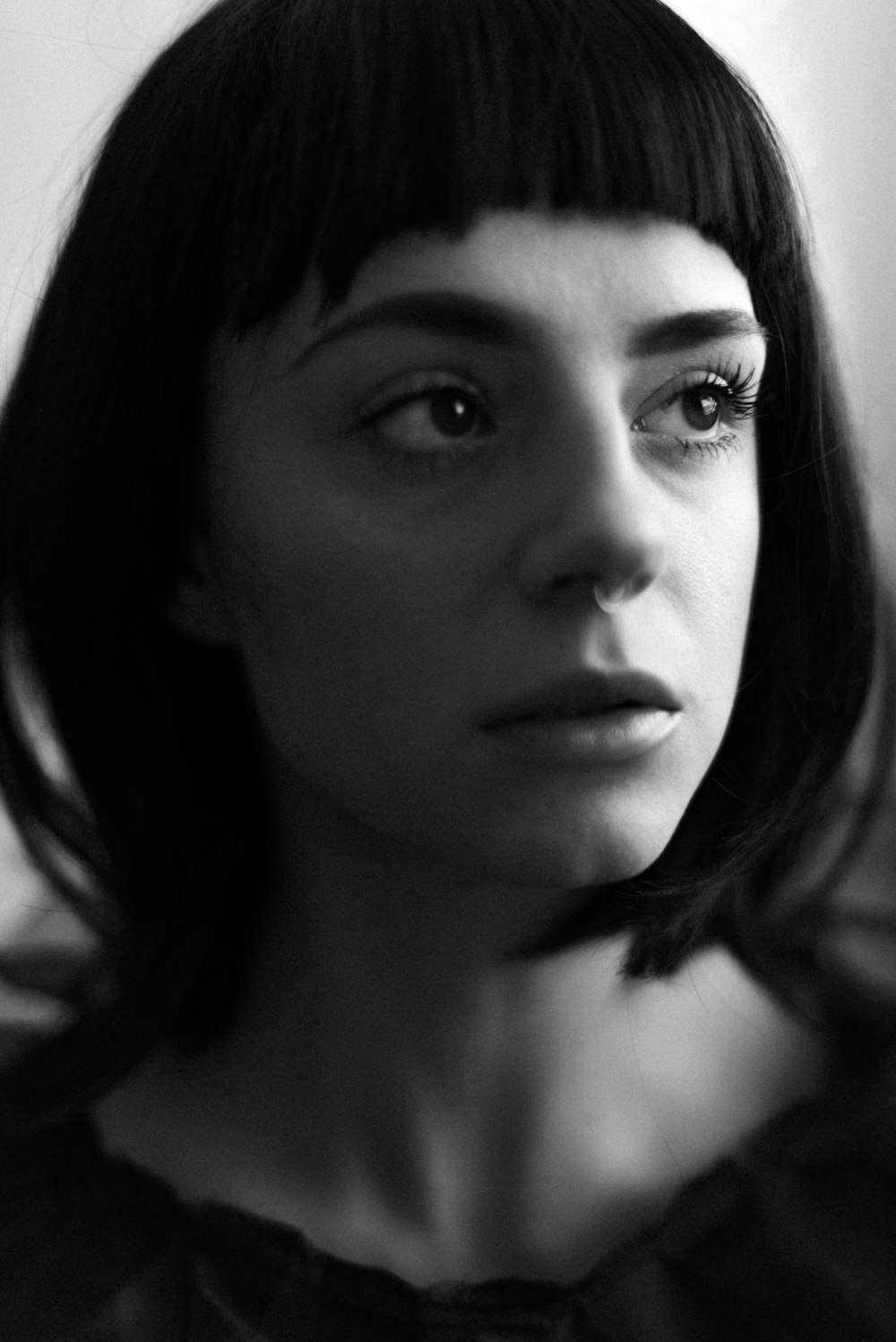 grayscale photo of womans face