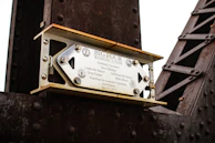 A weathered plaque commemorating the International Early Engines Conference.