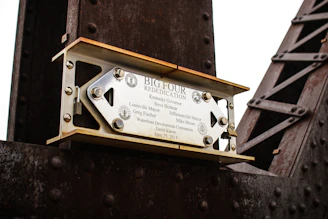 A weathered plaque commemorating the International Early Engines Conference.