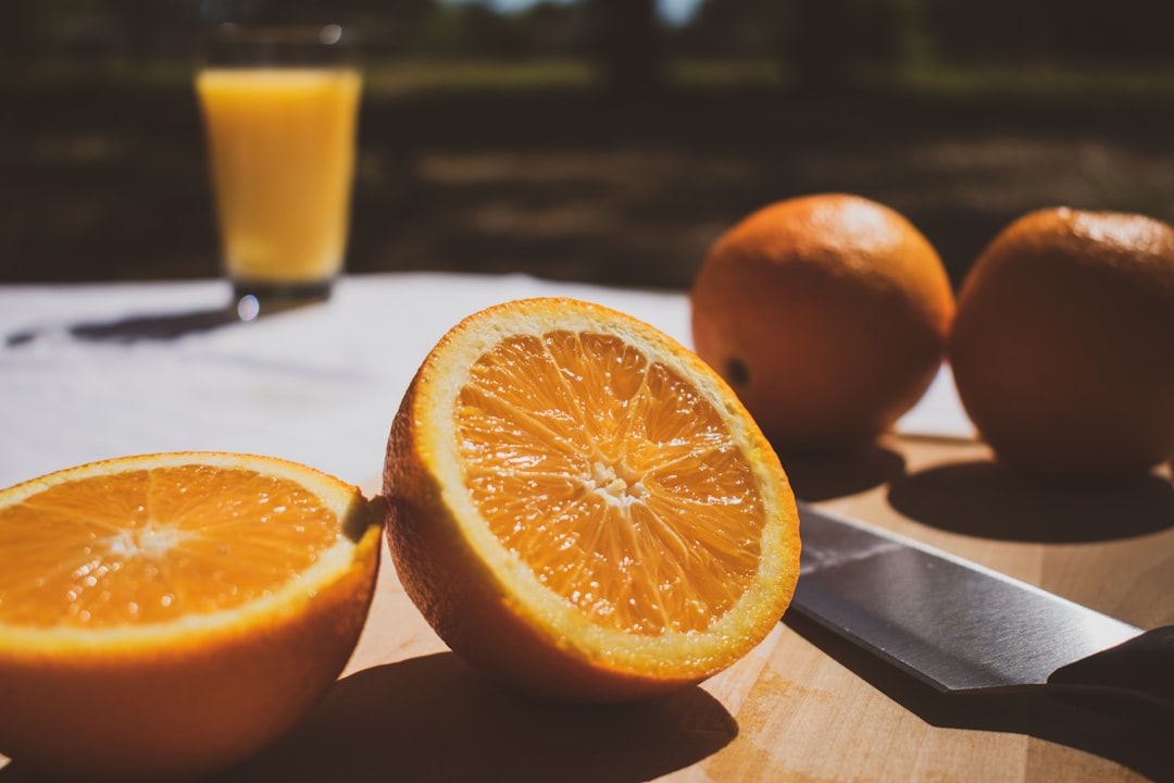 orange fruit on brown wooden table