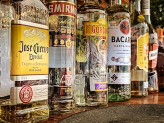 clear glass bottles on gray concrete floor