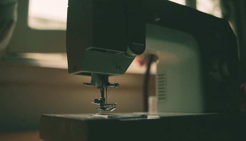 white sewing machine on table