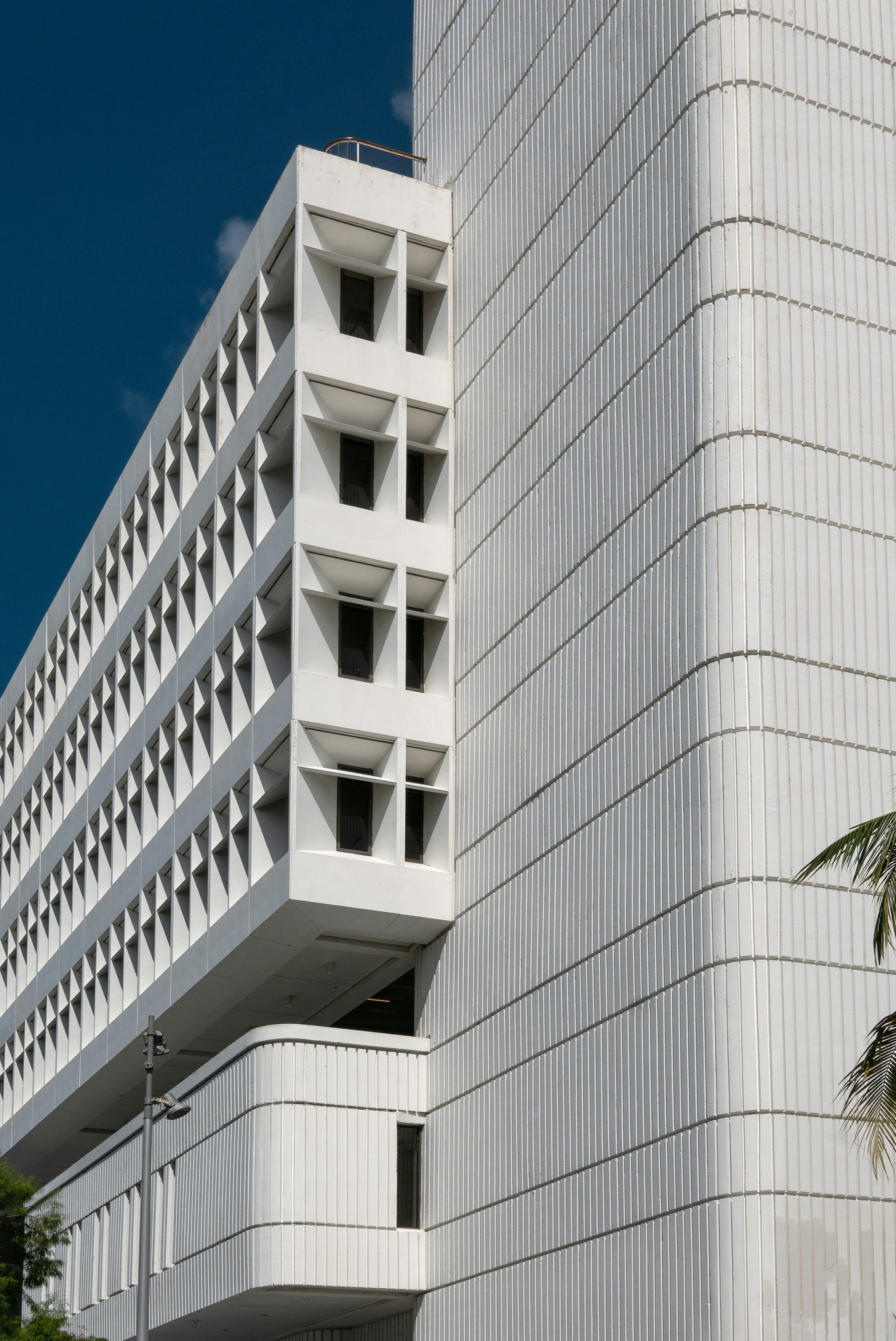 white concrete building under blue sky during daytime