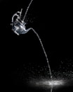 water pouring from clear glass mug