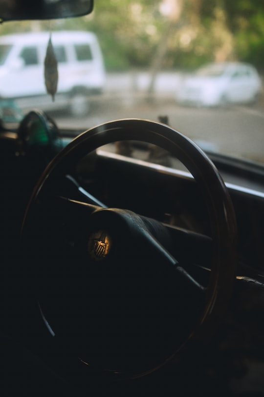 black steering wheel in tilt shift lens in Juhu India