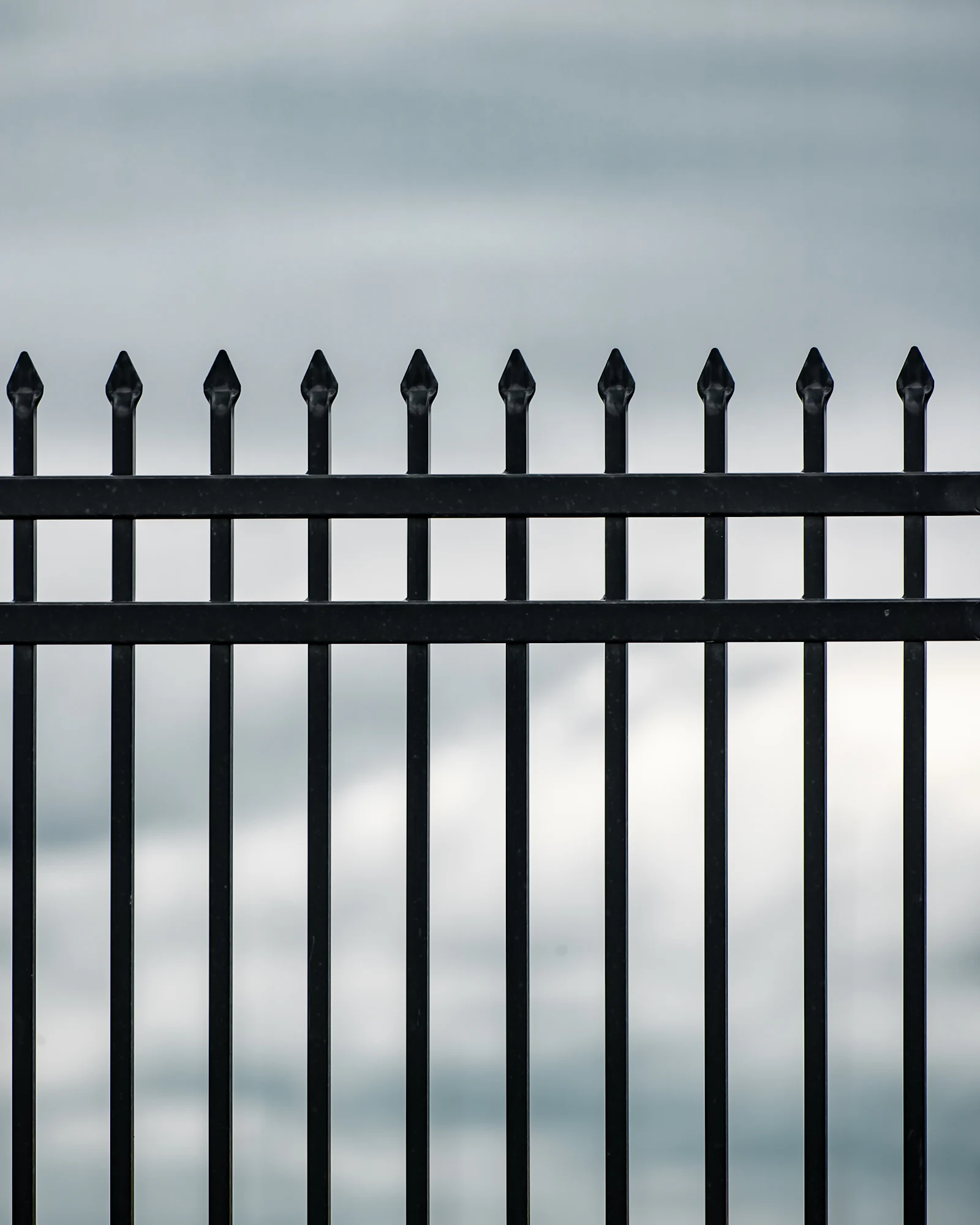 Black metal iron fence in a Houston-area neighborhood