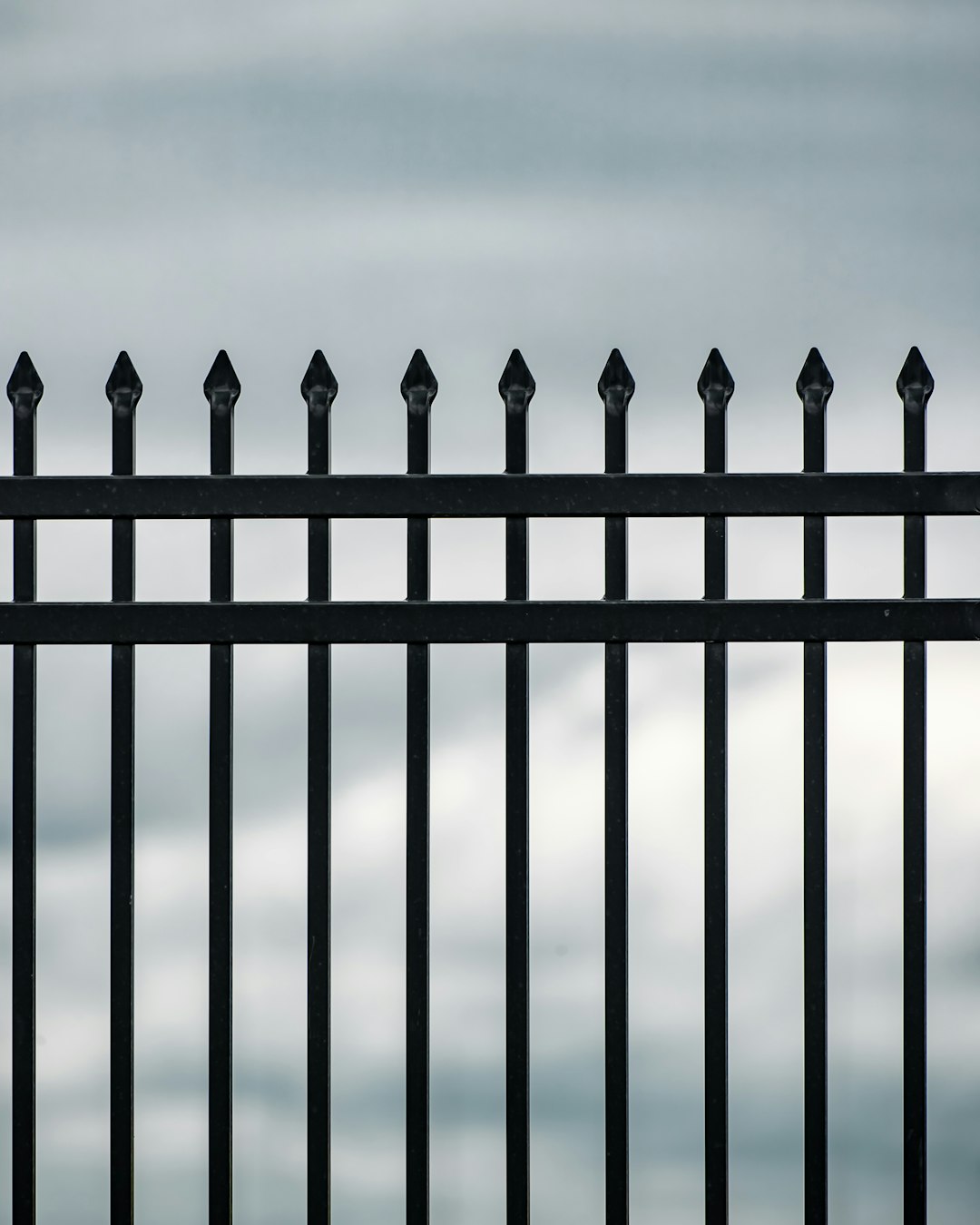 black metal fence during daytime