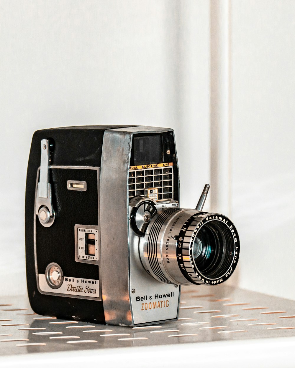 black and silver camera on brown wooden table