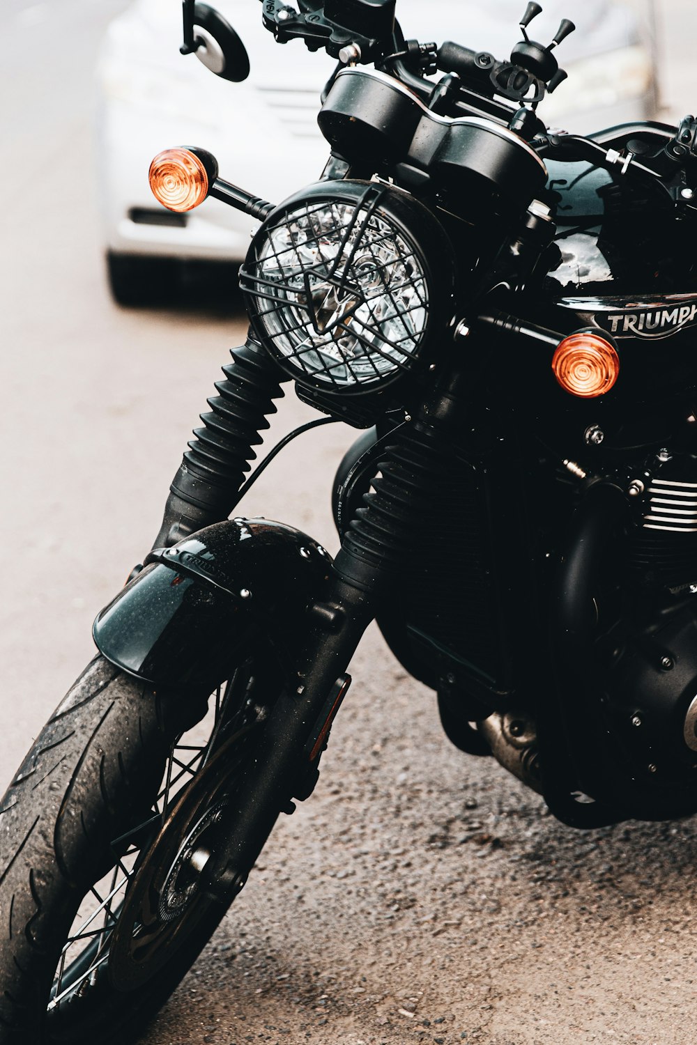 black motorcycle on gray concrete floor