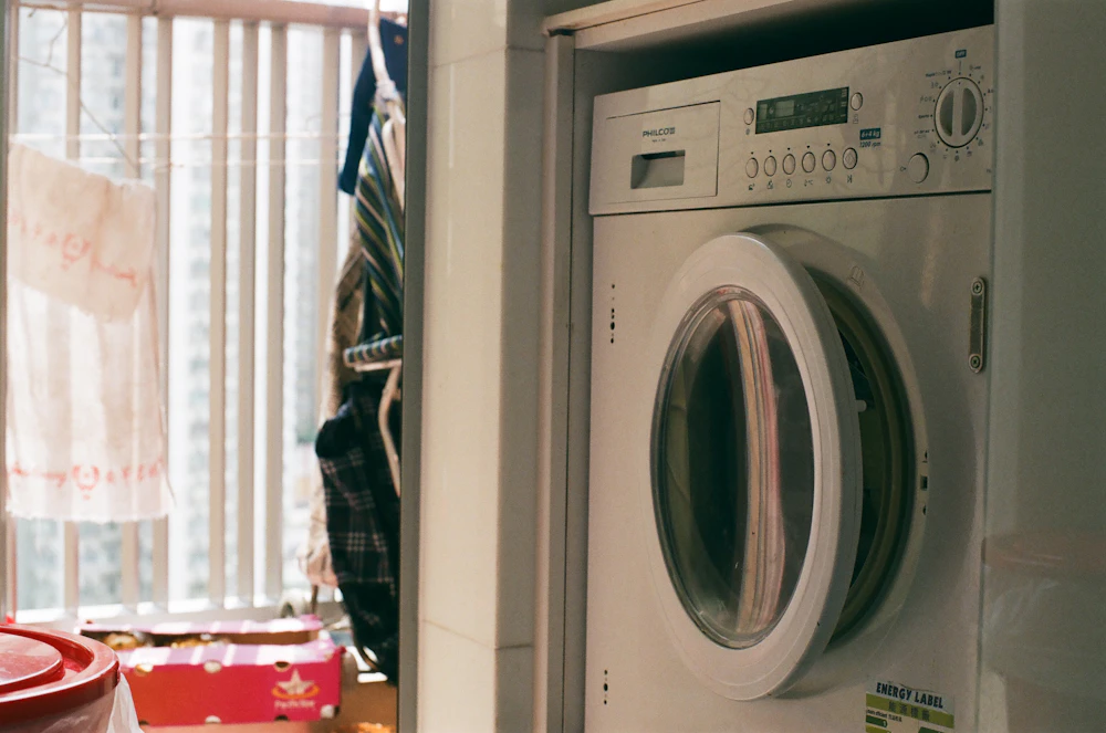 Appliance repair technician working in a Danvers, MA home