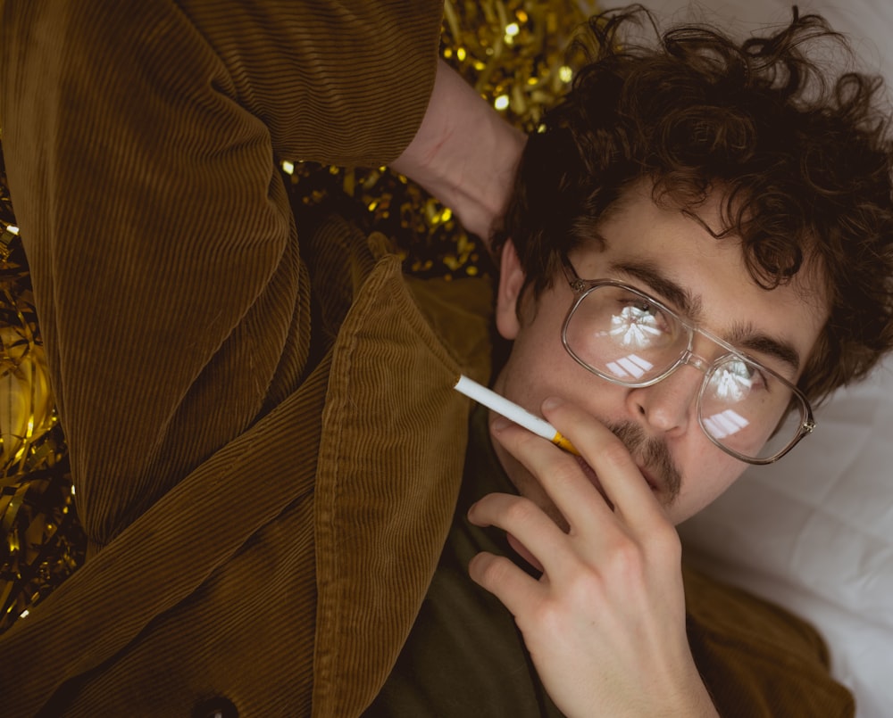 woman in green sweater smoking cigarette